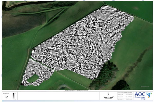 Satellite image with overlain greyscale imagery indicating the presence of buried archaeological features